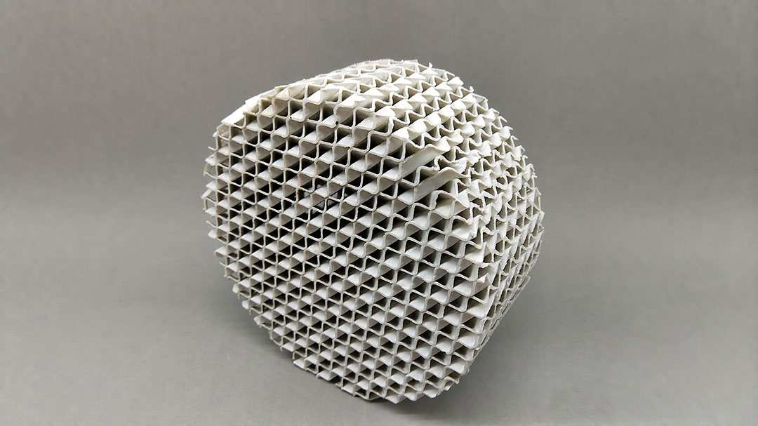 Multiple tiers of ceramic structured packing modules prepared for high-temperature column assembly